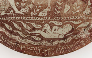 Plate; December 1210; Shamsuddin al-Hasani Abu Zayd; Iranian, Saljuq period; Stone-paste painted over glaze with luster; H: 3.7 W: 35.2 D: 35.2 cm; Kashan, Iran; Purchase, Freer Gallery of Art, Smithsonian, F1941.11